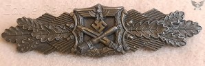 Maker marked Close Combat Clasp in bronze image 1